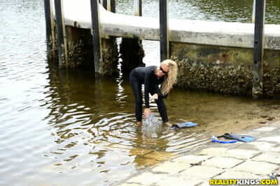 Blonde chick in wetsuit gets..